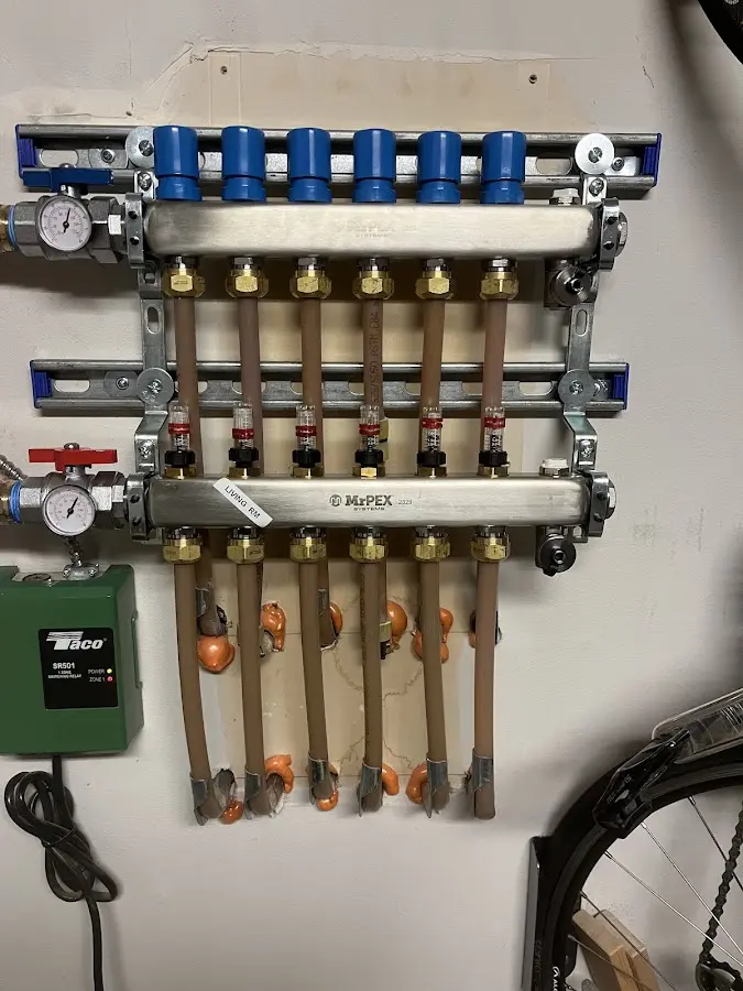 Plumber performing Water Heater Repair at a residential property in St. Clair Shores